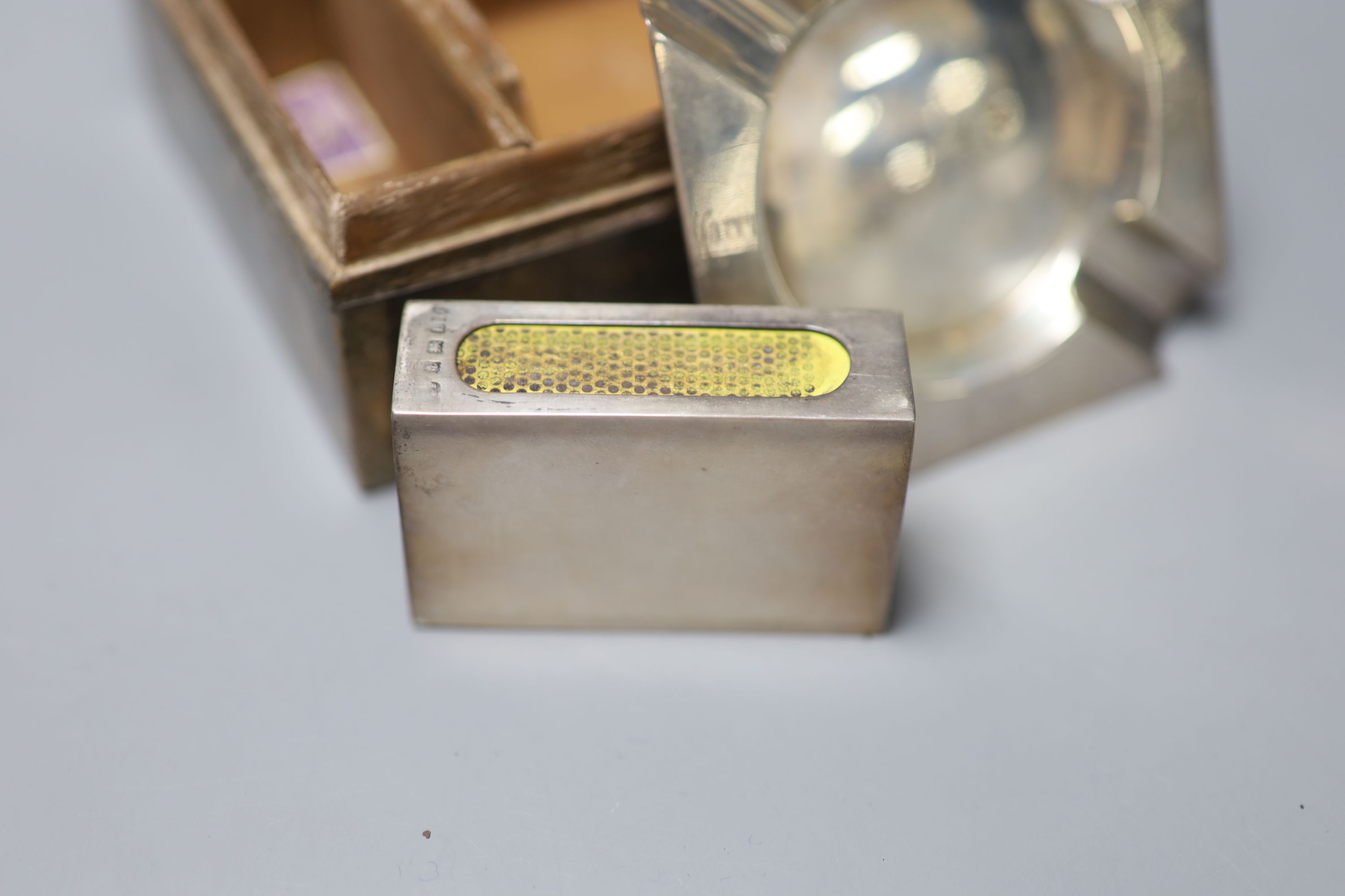 A 1920s silver and tortoiseshell mounted cigarette box, containing a fitted matched silver ashtray and mounted matchbox sleeve,